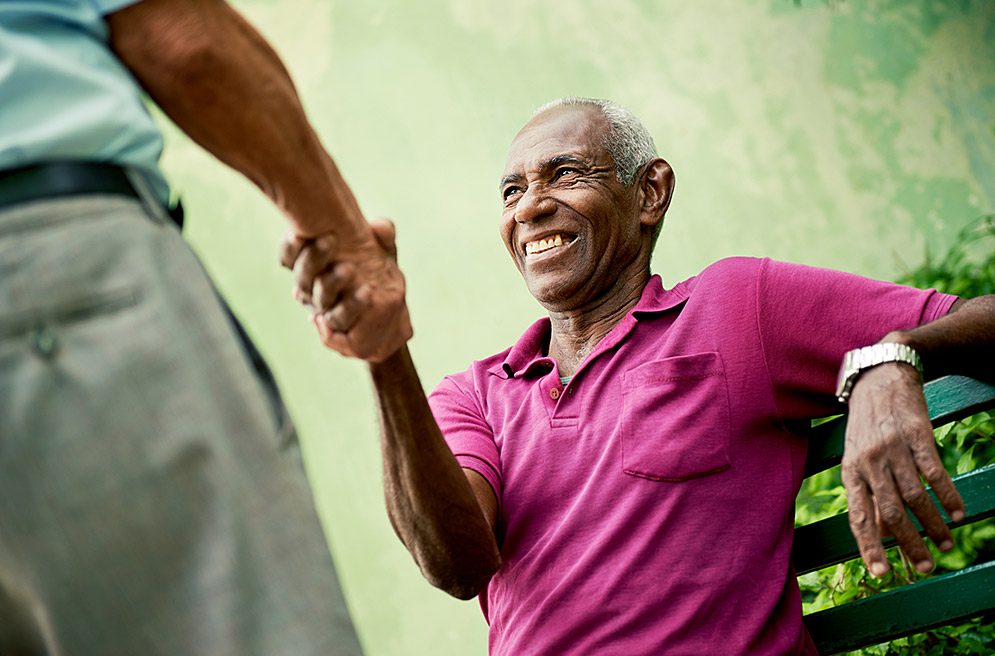 Senior man shaking hands