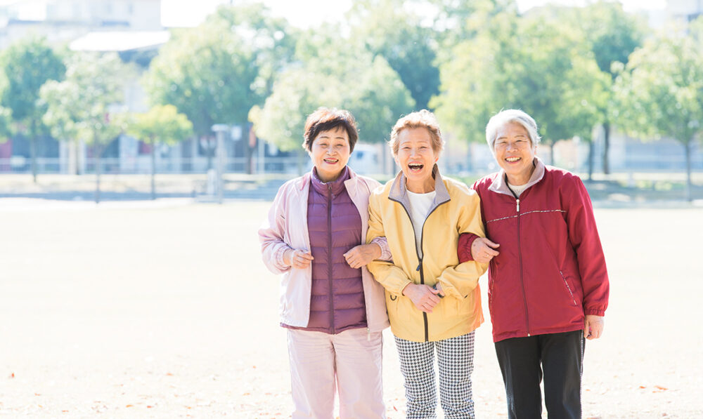 three senior women outside