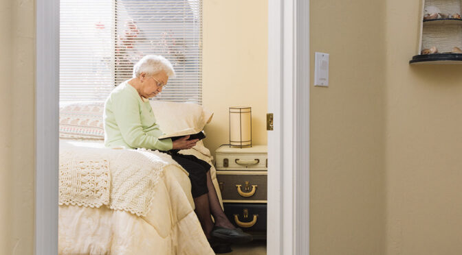 senior woman reading a book