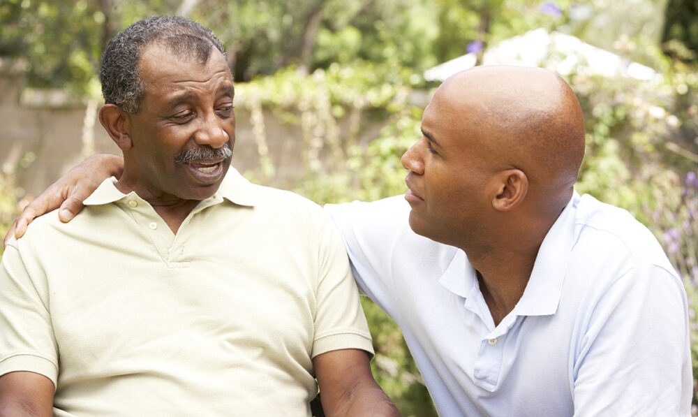 senior with son outside