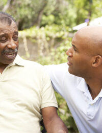 senior with son outside