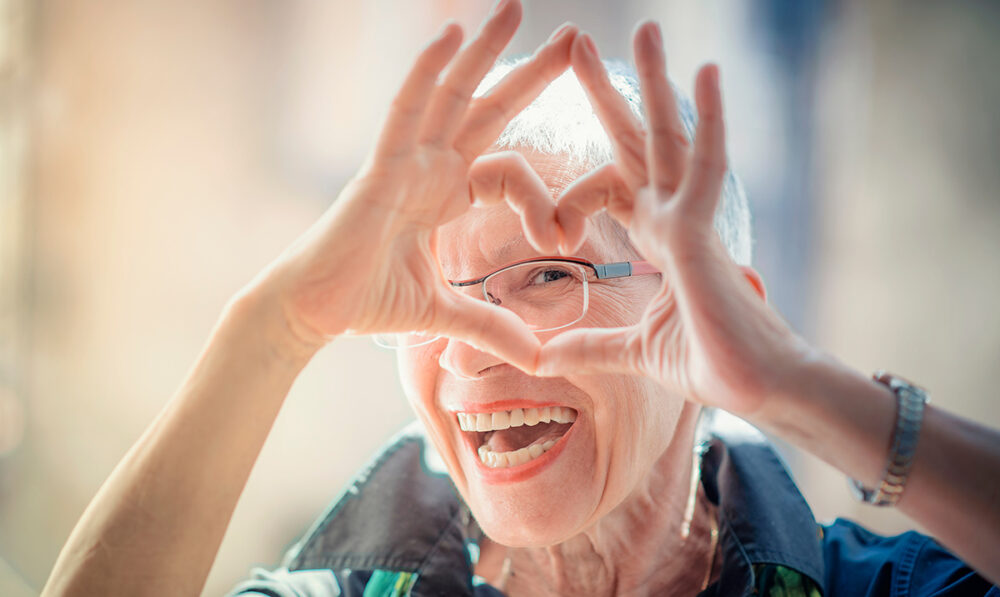 Senior Woman making a Heart Shape