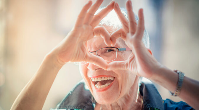 Senior Woman making a Heart Shape
